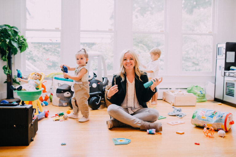a business woman and a child playing with toys