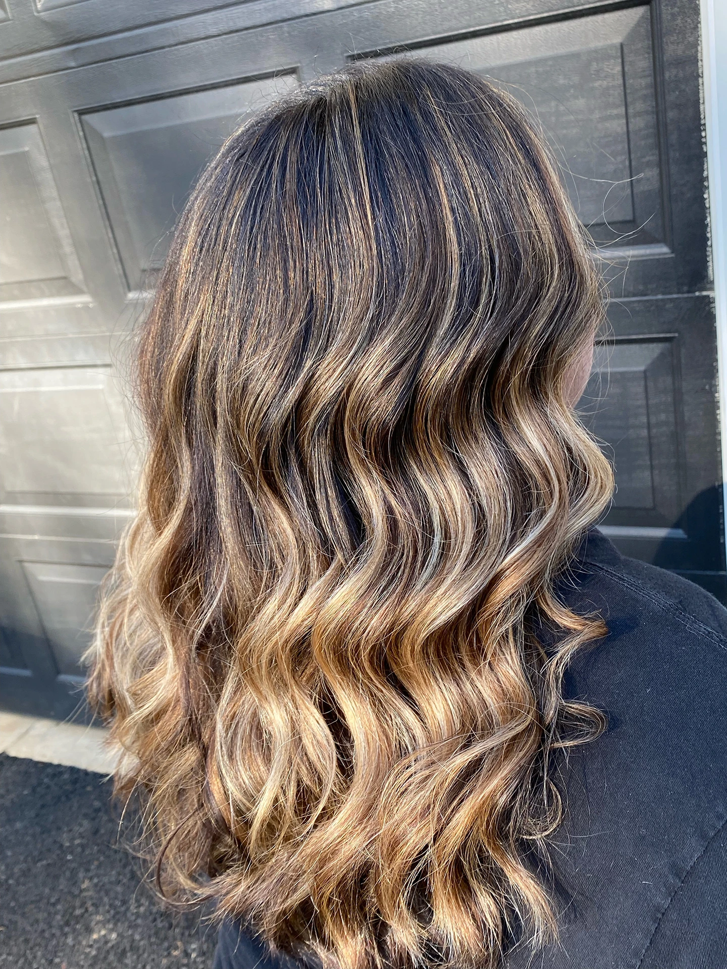 Balayage from dark hair to medium light blonde hair